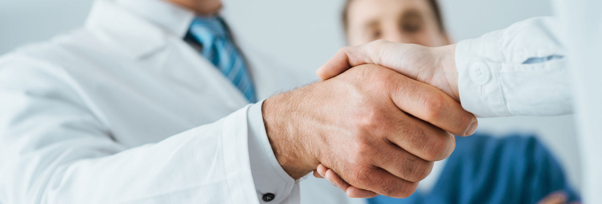 Doctor shaking hands with a patient