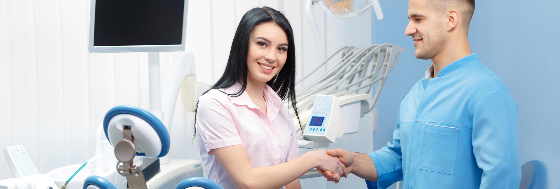 Doctor shaking hands with a female patient